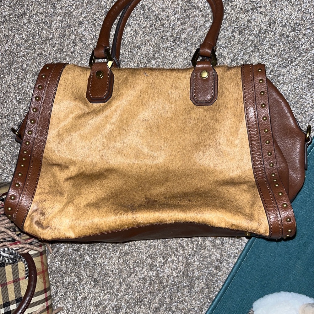 Beautiful medium size leather Yani bag with horse hair.  100% leather trim